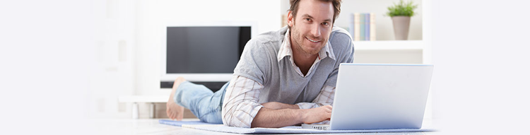 happy model on yoga mat with laptop